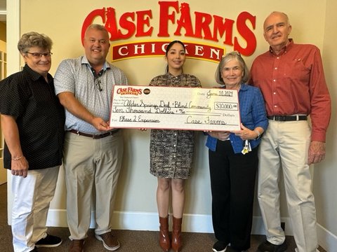 Case Farms Sr. Vice President Charles Rigdon announces a five-year $50,000 pledge to the $3.75 million capital campaign to expand Alder Springs Deaf & Blind Community in Morganton. Pictured left to right are Alder Springs Board Member Sandy Turner, Mr. Ri